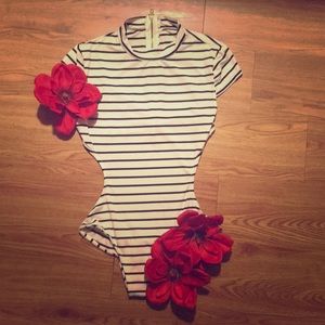 Black and white stripped body suit.